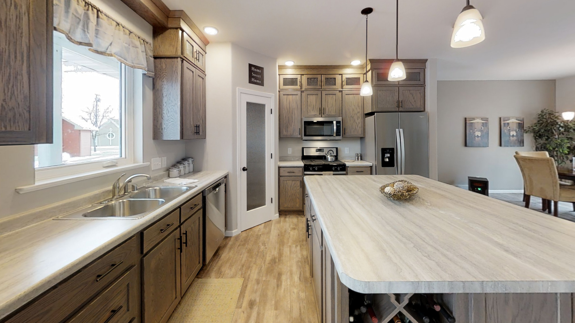 modern-kitchen-galley-dark-cabinets-large-island-stainless-steel_cvo7bu Wisconsin Homes